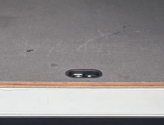 Lined load floor with tie-down points